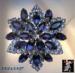 Brooch: Vintage Blue Rhinestone Ruffled Star Brooch Pin