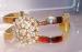Sleek Goldtone With Rhinestone Cluster