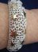 White Open Work & Gold Tone Star Hinged Bracelet
